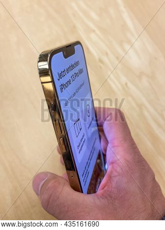Cologne, Germany - October 01st 2021: A German Photographer Comparing And Testing The New Iphone 13 