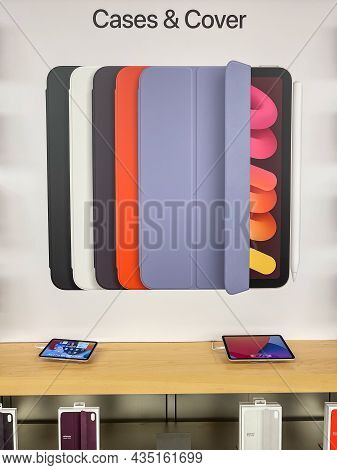 Cologne, Germany - September 30th 2021: A German Photographer Comparing Accessories As Phone Cases F