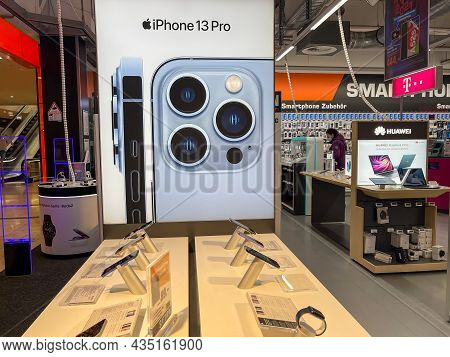 Frankfurt, Germany - October 04th 2021: A German Photographer Comparing And Testing The New Iphone 1