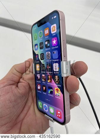 Frankfurt, Germany - October 04th 2021: A German Photographer Comparing And Testing The New Iphone 1