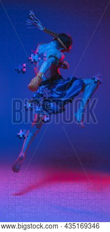 Fulll-length Portrait Of Young Male Sportsman Training Over Gradient Blue Background In Neon. Portra