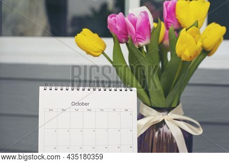 Calendar Desk And Tulip Flower On Table. Desktop Calender For Planner To Plan Wedding Agenda, Timeta