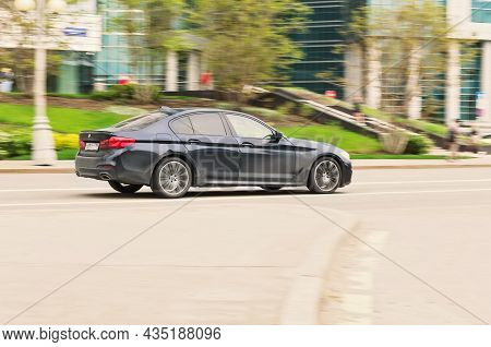 Bmw 530i G30 Is Driving On Asphalt Road On High Speed In The City Moscow. Moscow, Russia - May 2021