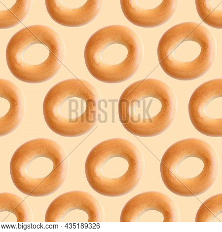 Bagels Seamless Pattern. Bublik Is A Donut-shaped Product Made From Wheat Dough In The Shape Of A To