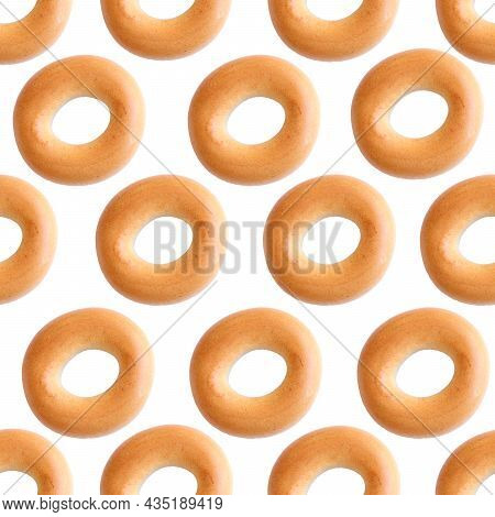 Bagels Seamless Pattern. Bublik Is A Donut-shaped Product Made From Wheat Dough In The Shape Of A To