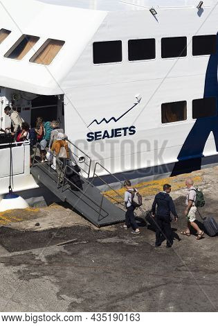 Naxos Island - Greece - September 27 2019 : High Speed Ferry With Passengers Boarding. Vertical Shot