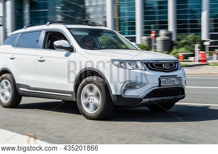 White Geely Boyue Geely Atlas Car In Motion On Urban Road. Geely Atlas Is A Compact Crossover Suv Of