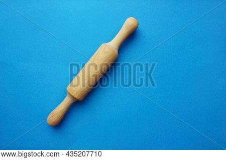 A Rock For A Test Made Of Wood On A Blue Background. Cooking And Baking. Cookery. View From Above. C