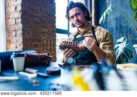 Hobby Became A Small Business Leather Man In Apron Is Making A Leather Wallet And Shooes In Studio