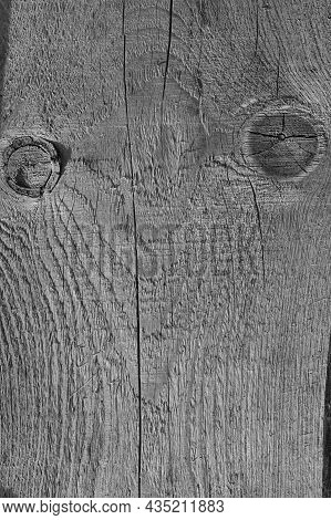 A Fragment Of A Rough, Textured, Wooden Board With Knots. Background Image. Close-up. Vertical, Blac