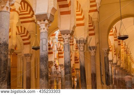 CORDOBA, SPAIN - August 11, 2021 - Arches within the Prayer Hall of the Mezquita (Mosque), Cordoba, Spain