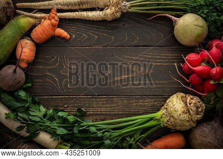 Root Vegetables On A Wooden Background