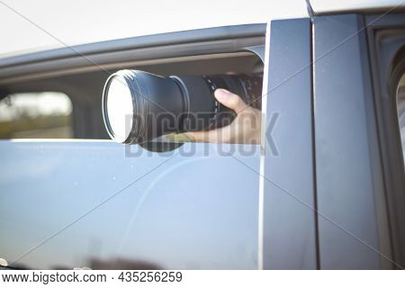A Man Taking A Picture From Inside The Car