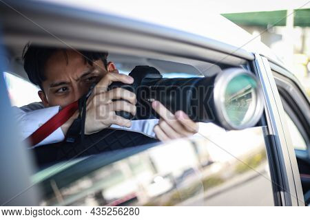 A Man Taking A Picture From Inside The Car