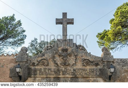 Main Entrance Carved In Stone Of The Christian Hermitage Of Cura At Sunset. Island Of Mallorca, Spai