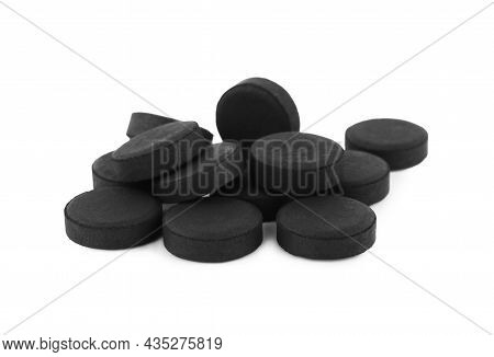 Activated Charcoal Pills On White Background. Potent Sorbent