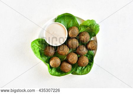 Falafel Balls. Deep Fried Balls From Ground Chickpeas On White Background. Top View, Flat Lay