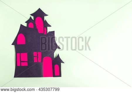 The Cardboard Applique Is A Dark House With Red Windows On A Light Background. Handmade From Colored