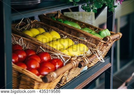 Vegetables In Baskets, Red Tomatoes, Yellow Lemons, Sweet Green Pepper. Open Kitchen Restaurant Conc