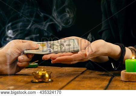 A Fortune Teller Or Oracle Takes Money For Their Work. Fortune Telling By Hand, Geromancy. Psychic R