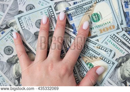A Bunch Of Dollars In The Hands Of A Close-up. The Background Is Made Of Dollars. Isolated Dollars