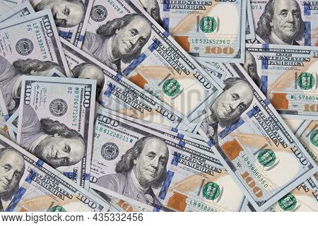 Background Of Hundred-dollar Bills. The Texture Of Hundred-dollar Bills. A Lot Of Dollars