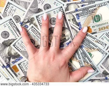 A Bunch Of Dollars In The Hands Of A Close-up. The Background Is Made Of Dollars. Isolated Dollars
