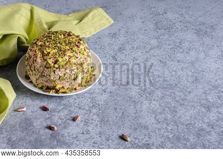 Halva With Pistachios On Top, Few Scattered Nuts, Green Linen Napkin And Large Copy Space. Tradition