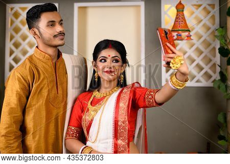 Portrait Of Indian Men Dressed In Kurta Pajama With Beautiful Indian Woman Wearing Traditional India