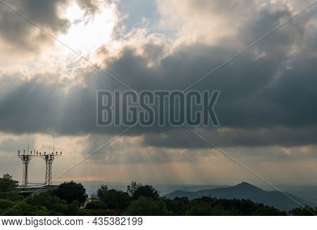 Mountainous Mediterranean Landscape At Sunset With Radio And Televisión Signal Repeater Antennas, On
