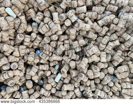 Abrau-dyurso, Russia, January 2, 2021: Background Texture Of A Randomly Scattered Pile Of Used Wine 