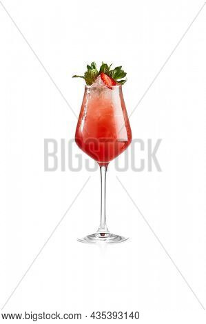 Strawberry cold cocktail with alcohol isolated on white background. Alcoholic strawberry mojito in wine glass. Summer cocktail in bar menu. Elegant beverage. Classic alcohol drink