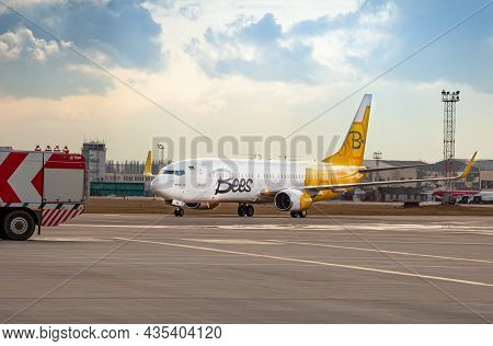 Bees Airline Yellow Plane On The Apron. Boeing 737-800 Ur-uba Passenger Aircraft. Ukraine, Kyiv - Ma
