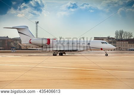 Small White Plane At The Airport. Runway. Charter Flight. Flight On A Journey. Fly In A Private Jet.