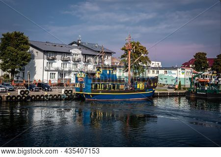 Dziwnow, Poland - September 10, 2021: A Blue Tourist Boat Moored At The Pier.