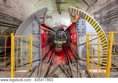 Mine Car Unloader. Device For Unloading Ore From Cargo Mine Train.