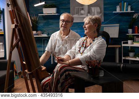 Senior Couple With Artistic Hobby Working On Masterpiece For Art Project In Artwork Room. Elder Man 
