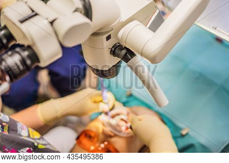 Dental Treatment With A Microscope. Woman Having Teeth Examined At Dentists. Appointment At The Dent