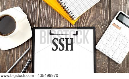 Ssh Text On Paper With Coffee, Calculator And Notebook. Business