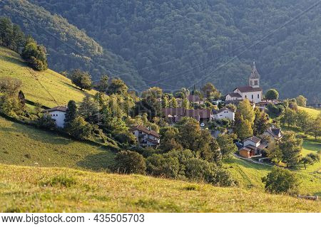 The Small Mountain Village Of Venon And Its Church Among The Meadows