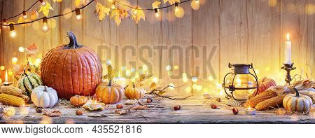 Pumpkins On Wooden Table - Thanksgiving Background With Vegetables And Bokeh Lights