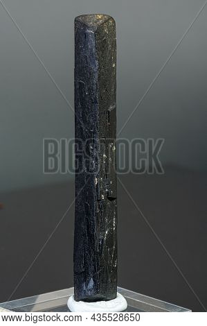 Macro Mineral Stone Ilvaite On A Gray Background Close-up