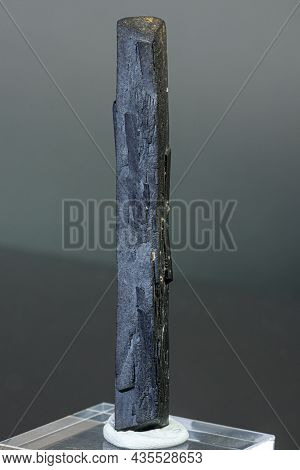 Macro Mineral Stone Ilvaite On A Gray Background Close-up