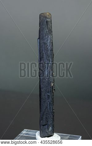 Macro Mineral Stone Ilvaite On A Gray Background Close-up