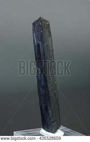 Macro Mineral Stone Ilvaite On A Gray Background Close-up