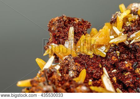 Macro Mineral Wulfenite Stone On A Black Background Close-up