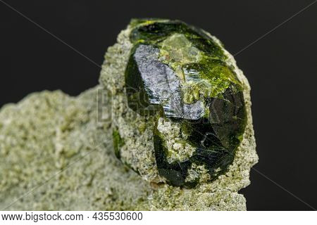 Macro Mineral Stone Andradite On A Black Background Close-up