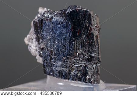 Macro Mineral Acanthite Stone On A Black Background Close-up