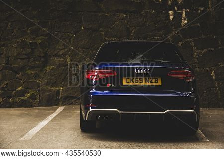Kiev, Ukraine - June 12, 2021: Blue Sports Hatchback Audi S3 Against The Background Of A Stone Wall
