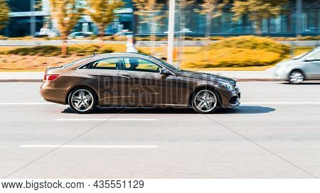 Moscow, Russia - August 2021: Mercedes E Class C207 On The Road In Motion. Fast Speed Drive On City 